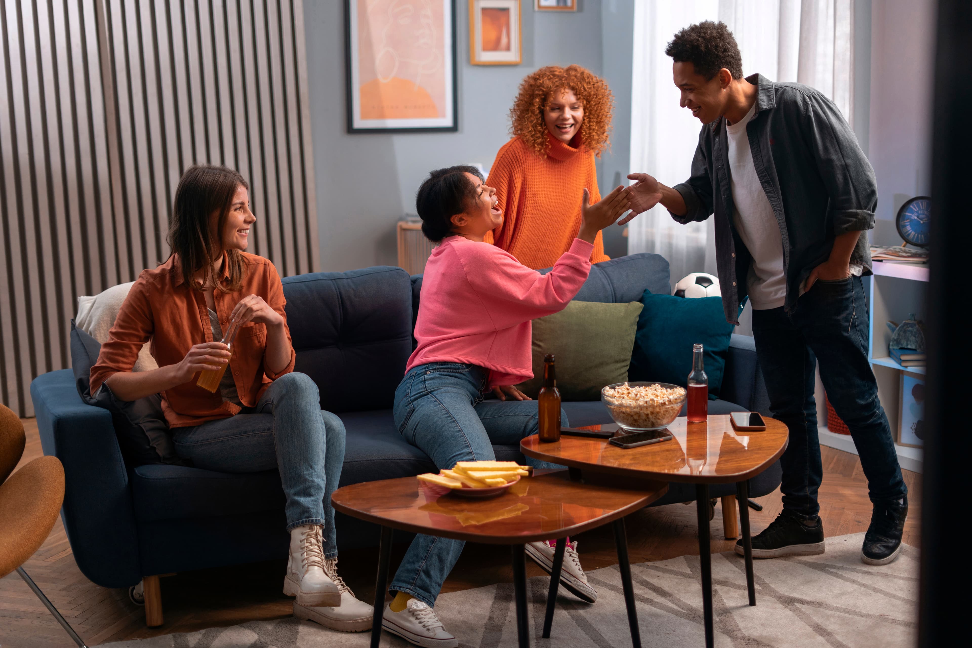 Friends gathered around a coffee table in a living room